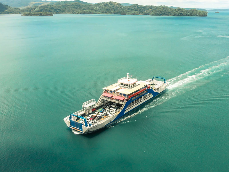 A large boat traveling across a large body of water.