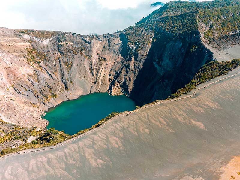 An aerial view of a mountain and a lake.