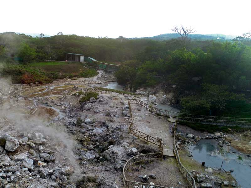 An aerial view of a hot spring in the mountains.